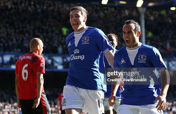 Dan Gosling of Everton celebrates scoring his team's second goal with Landon Donovan during the Barclays Premier League match between Everton and...