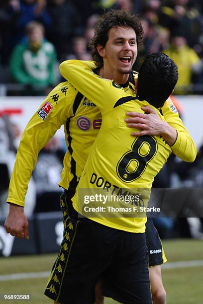 Neven Subotic and Nuri Sahin of Dortmund celebrate their teams first goal during the Bundesliga match between Borussia Dortmund and Hannover 96 at...