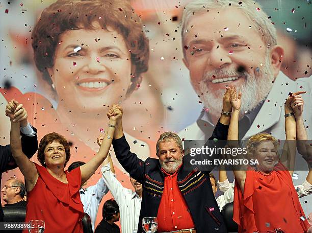 Brazilian President Luiz Inacio Lula da Silva , his wife Marisa Leticia and his Chief of Staff Dilma Rousseff gesture during the Workers� Party...