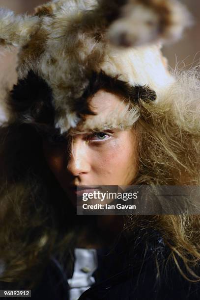 Model prepares back stage prior to the Unique Fashion Show during London Fashion Week on February 20, 2010 in London, England.