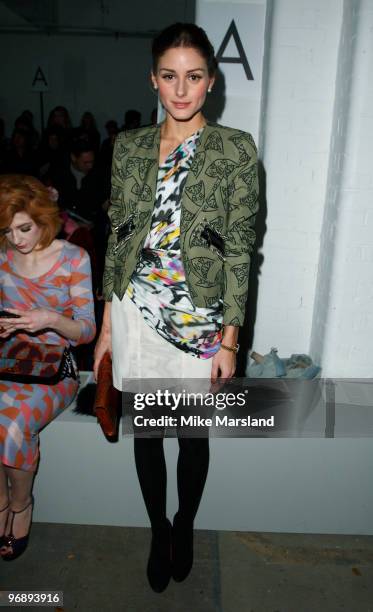 Olivia Palermo poses on the front row at the Unique show for London Fashion Week Autumn/Winter 2010 at TopShop Venue on February 20, 2010 in London,...