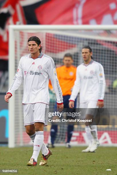 Mario Gomez and Martin Demichelis of Bayern look dejected after receiving the first goal of Nuernberg during the Bundesliga match between 1. FC...