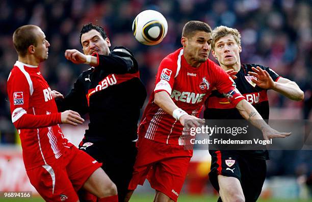 Miso Brecko and Youssef Mohamad of Koeln battle for the ball with Timo Gebhart and Pavel Pogrebnyak of Stuttgart during the Bundesliga match between...