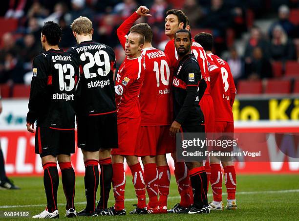 Miso Brecko of Koeln and Cacau of Stuttgart look back during the Bundesliga match between 1. FC Koeln and VfB Stuttgart at RheinEnergieStadion on...