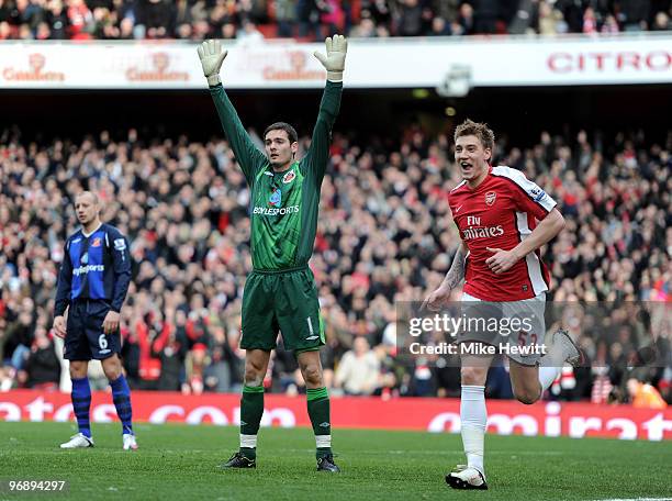 Nicklas Bendtner of Arsenal celebrates his tap in as Craig Gordon of Sunderland appeals for offside during the Barclays Premiere League match between...