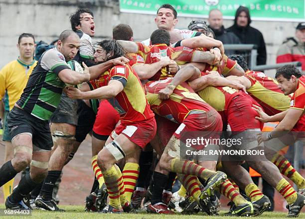 Montauban's flanker Abdelatif Boutaty clears the ball out of a scrum during their French Top 14 rugby union match Montauban vs Perpignan on February...