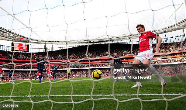 Nicklas Bendtner of Arsenal taps in from close range during the Barclays Premiere League match between Arsenal and Sunderland at Emirates Stadium on...