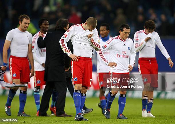 The team of Hamburg look dejected after the Bundesliga match between Hamburger SV and Eintracht Frankfurt at HSH Nordbank Arena on February 20, 2010...