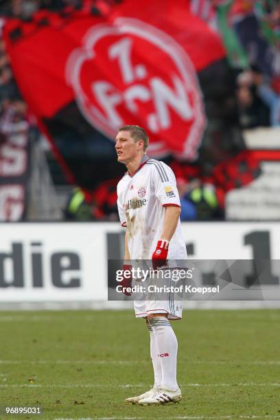 Bastian Schweinsteiger of Bayern looks dejected after the 1-1 draw of the Bundesliga match between 1. FC Nuernberg and FC Bayern Muenchen at Easy...