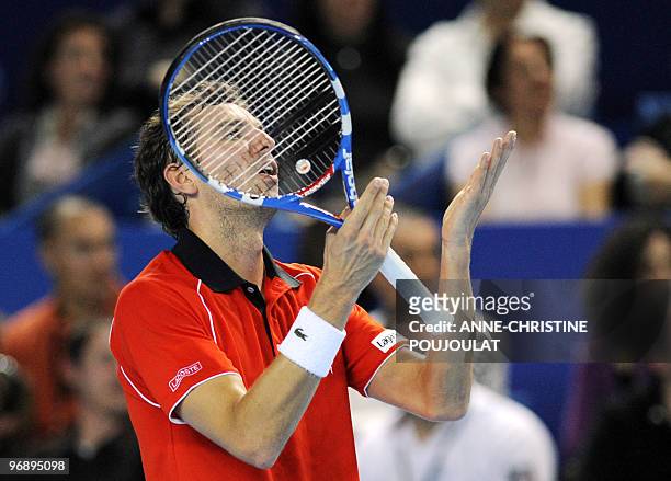 French Julien Benneteau reacts after losing a point against his compatriot Jo-Wilfried Tsonga during their ATP Open 13 semi final tennis match on...