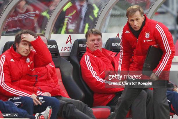 Head coach Louis van Gaal of Bayern and assistant coach Andries Jonker look dejected after the 1-1 draw of the Bundesliga match between 1. FC...