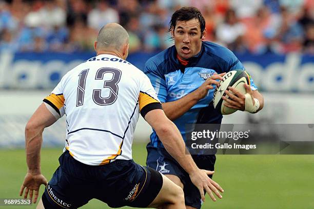 Stirling Mortlock of Brumbies and Pedrie Wannenburg of Bulls in action during the Super 14 match between Vodacom Bulls and Brumbies from Loftus...