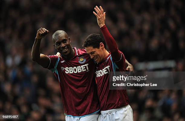 Carlton Cole of West Ham celebrates scoring their second goal with Guillermo Franco during the Barclays Premier League match between West Ham United...