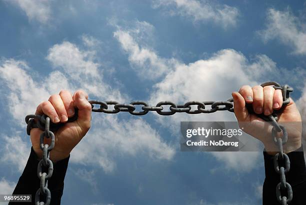 hands holding chain - interlocking arms stock pictures, royalty-free photos & images
