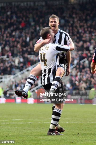 Ryan Taylor celebrates on top of Kevin Nolan after scoring the third goal during the Coca-Cola championship match between Newcastle United and...