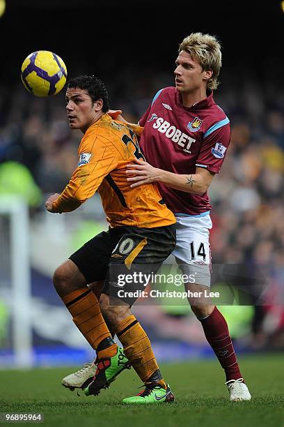 Amr Zaki of Hull battles with Radoslav Kovac of West Ham during the Barclays Premier League match between West Ham United and Hull City at Boleyn...