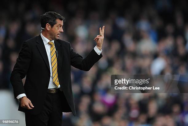 Manager Phil Brown of Hull issues instructions to his players during the Barclays Premier League match between West Ham United and Hull City at...