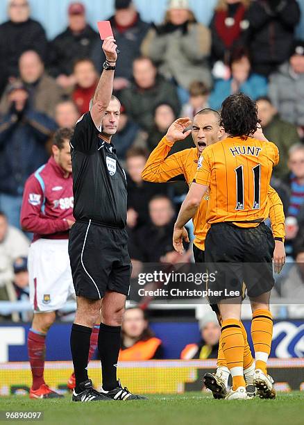 Craig Fagan of Hull is sent off by referee Martin Atkinson during the Barclays Premier League match between West Ham United and Hull City at Boleyn...