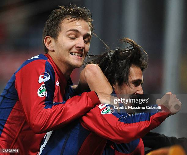 Robert Acquafresca of Genoa CFC celebrates his team's opening goal with team mate Domenico Criscito during the Serie A match between Genoa CFC and...