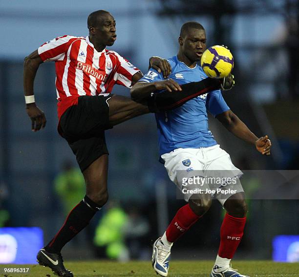Papa Bouba Diop of Portsmouth competes against Mamady Sidibe of Stoke City during the Barclays Premier League match between Portsmouth and Sunderland...