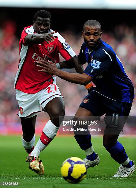 Emmanuel Eboue of Arsenal battles with Darren Bent of Sunderland during the Barclays Premiere League match between Arsenal and Sunderland at Emirates...