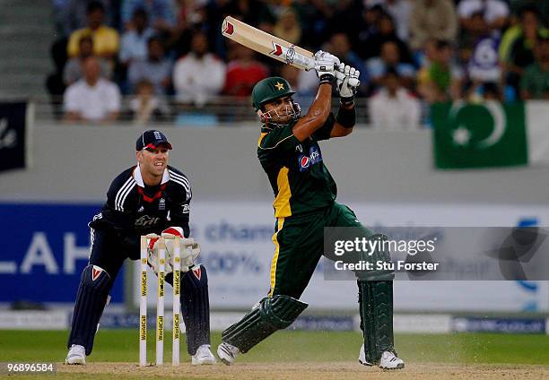 England wicketkeeper Matt Prior looks on as Pakistan batsman Umar Akmal hits out during the 2nd World Call T-20 Challenge match between Pakistan and...