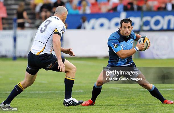 Stirling Mortlock of Brumbies tackles Francois Hougaard of Bulls during the Super 14 match between Vodacom Bulls and Brumbies from Loftus Versfeld...