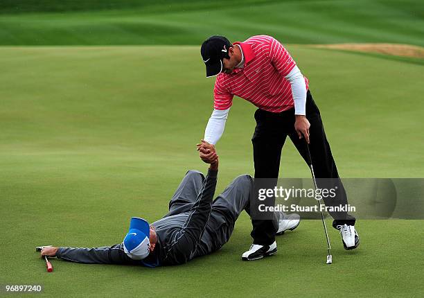 Stewart Cink lays on the ground in submission after losing his match against Paul Casey of England during round four of the Accenture Match Play...
