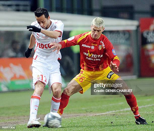 Lens' French midfielder Yohan Demont vies with Monaco's Brazilian forward Anderson Luis de Carvalho Nene during the French L1 football match Lens vs...