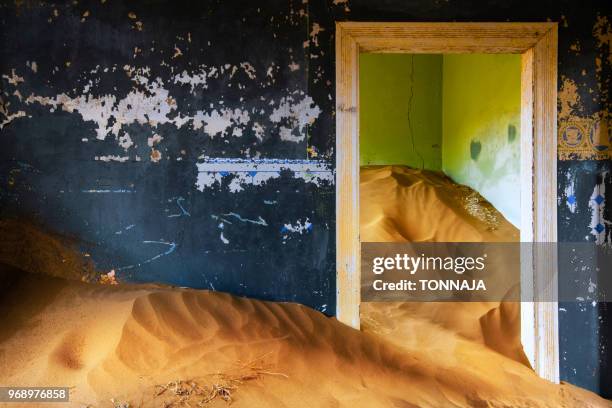 inside of abandoned building at ghost town kolmanskop in namibia, africa - kolmanskop namibia stock pictures, royalty-free photos & images