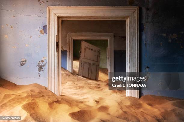 inside of abandoned building at ghost town kolmanskop in namibia, africa - kolmanskop stockfoto's en -beelden