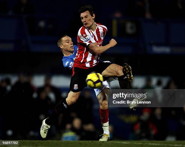 Dean Whitehead of Stoke is tackled by Jamie O'Hara of Portsmouth during the Barclays Premier League match between Portsmouth and Stoke City at...