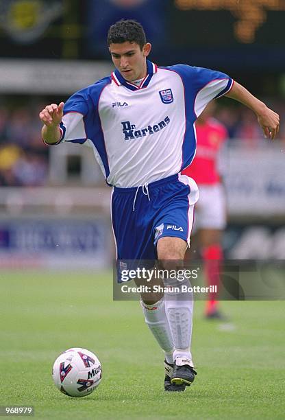 Tarkan Mustafa of Rushden & Diamonds runs with the ball during the pre-season friendly match against Arsenal played at Nene Park, in Irthlinborough,...