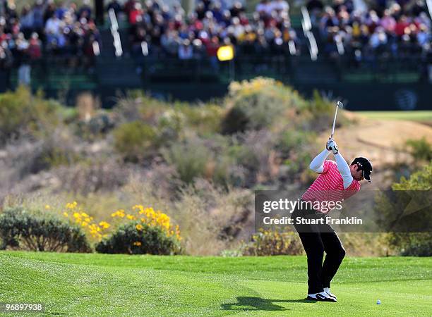 Paul Casey of England plays his approach shot on the ninth hole during round four of the Accenture Match Play Championship at the Ritz-Carlton Golf...