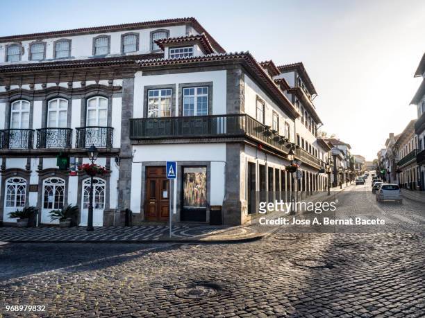 view of the streets of the city of angra do heroísmo, a unesco world heritage site, on terceira island in the azores islands, portugal. - cobblestone transport stock pictures, royalty-free photos & images