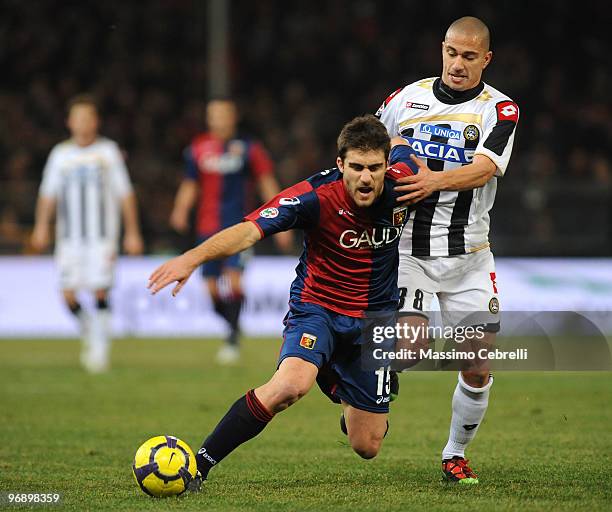 Sokratis Papastathopoulos of Genoa CFC battles for the ball against Gokhan Inler of Udinese Calcio during the Serie A match between Genoa CFC and...