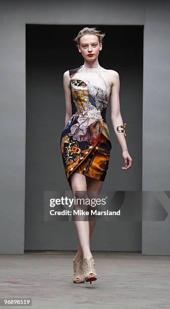 Model walks the runway at the Mark Fast/Mary Katrantzou show for London Fashion Week Autumn/Winter 2010 at TopShop Venue on February 20, 2010 in...