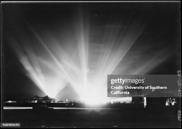 Search lights in the night sky at Manchester Square, Southern California, 1926.