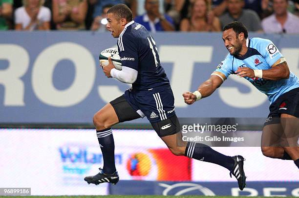 Bryan Habana of the Stormers breaks past Sosene Anesi of the Waratahs to score his second try during the Super 14 match between Vodacom Stormers and...