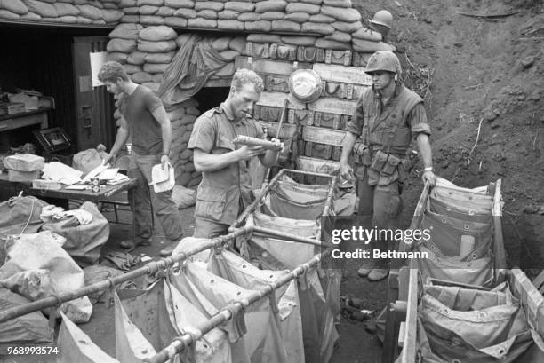 Not Rain, Snow or War. . .Will stop the U.S. Mail. Proving it is this frontline post office set up behind bunkers at Khe Sanh, where reportedly some...