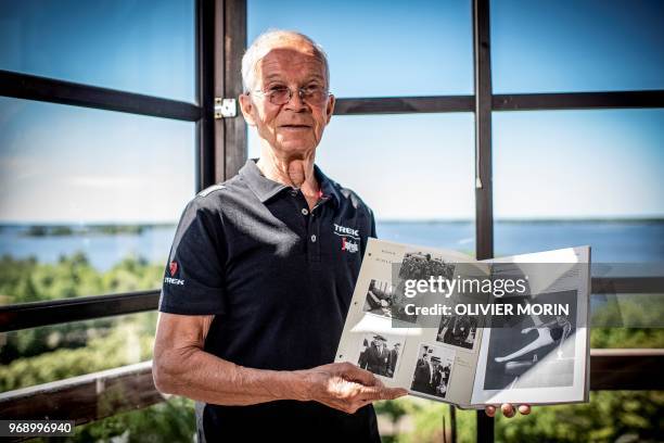 Former Finnish Olympic gymnastics athlete in Rome and Tokyo , Kauko Heikkinen poses with his photo album of Olympic games at his home in Vaasa,...