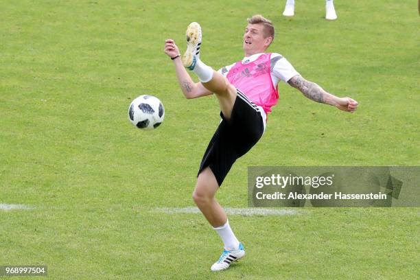 Toni Kroos battles for the ball during a training session of the German national team at Sportanlage Rungg on day sixteen of the Southern Tyrol...