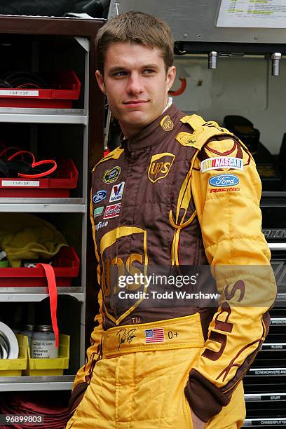 David Ragan, driver of the UPS Ford, looks on from the garage area during practice for the NASCAR Sprint Cup Series Auto Club 500 at Auto Club...