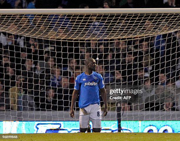 Portsmouth's Senegalese player Papa Bouba Diop looks on after Stoke CIty's Senegalese player Salif Diao scores the winning goal during the English...