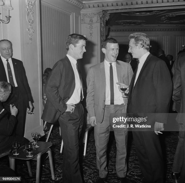 Scottish soccer players Denis Law, Bobby Lennox and Jim McCalliog at an after match reception, UK, 17th April 1967.