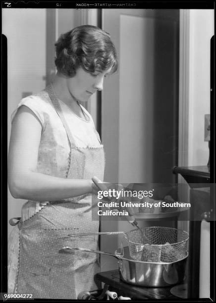 Mrs RH Johnson cooking, 1140 Stockbridge - Emery Park, Southern California, 1931.