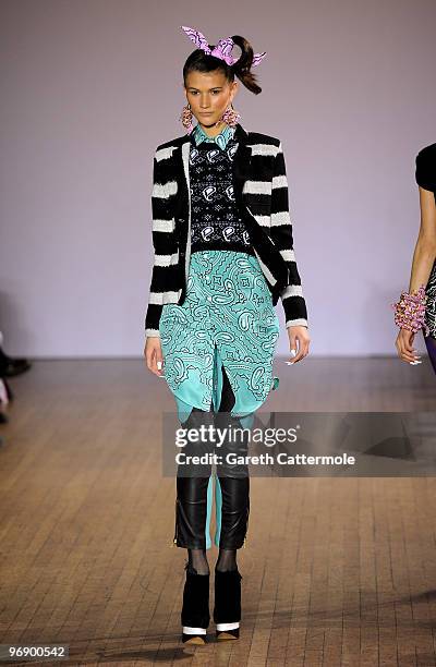 Model walks down the catwalk during the House of Holland fashion show during London Fashion Week on February 20, 2010 in London, England.