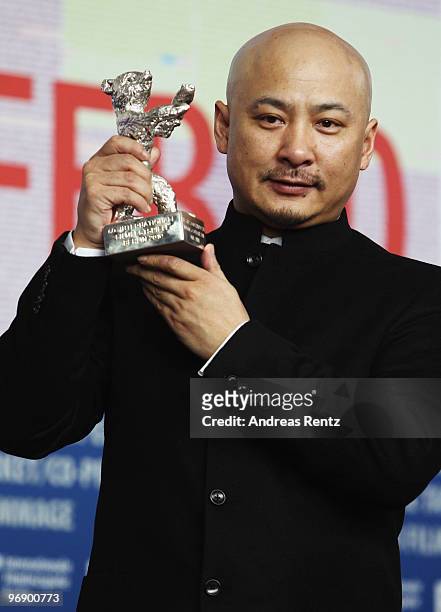 Director Wang Quan'an poses with the Silver Bear for Best Script of 'Tuan Yuan' at the 'Award Winners' Photocall during day ten of the 60th Berlin...