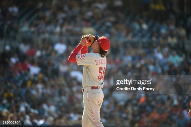 Luis Castillo of the Cincinnati Reds gestures during a baseball game against the San Diego Padres at PETCO Park on June 3, 2018 in San Diego,...