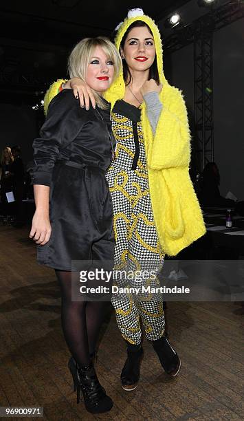 Victoria Hesketh and Marina Diamandis of the band Marina and the Diamonds pose on the front row at the House Of Holland show for London Fashion Week...